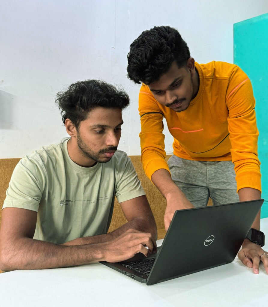 The Best Digital Marketing specialist in Thrissur explaining something to a fellow Digital Marketer